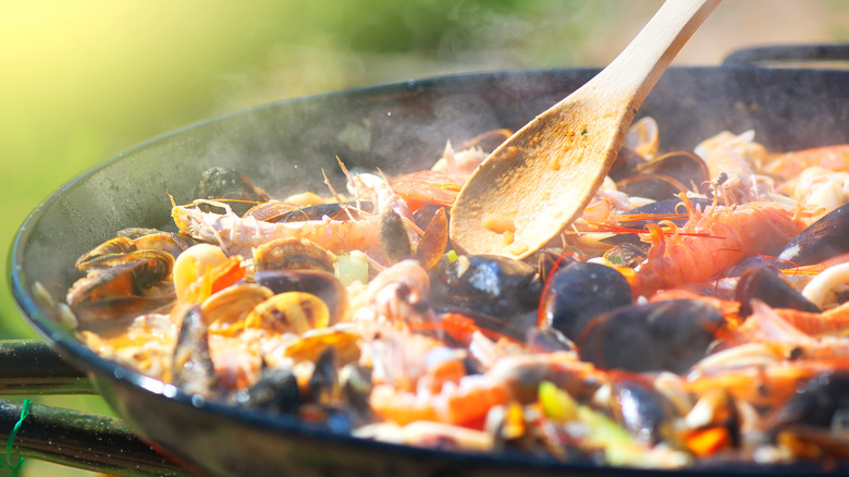 Paella cooking in skillet