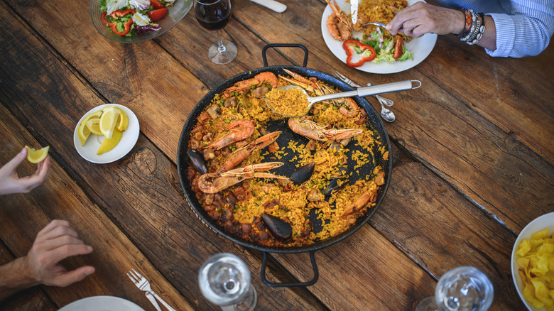 Seafood paella on wood table