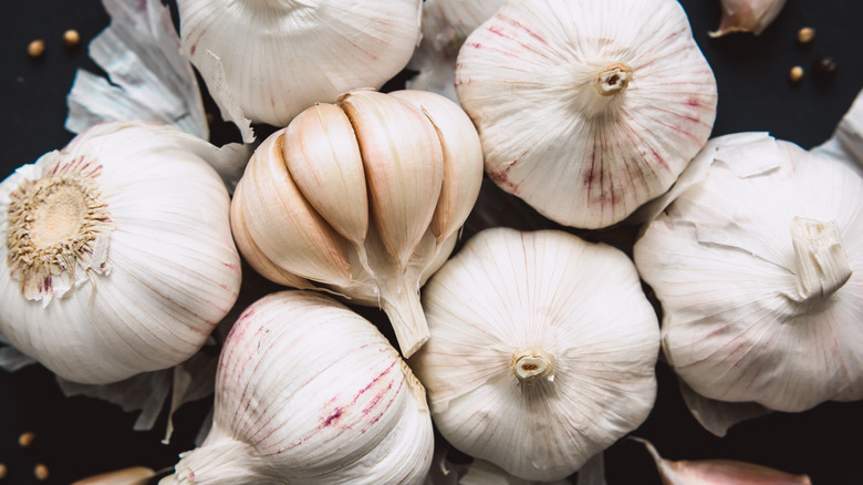 Garlic bulbs on black background