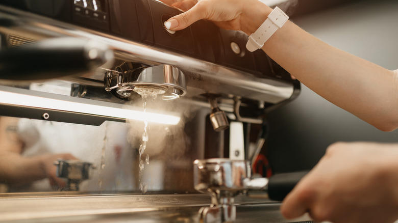 barista purging espresso machine