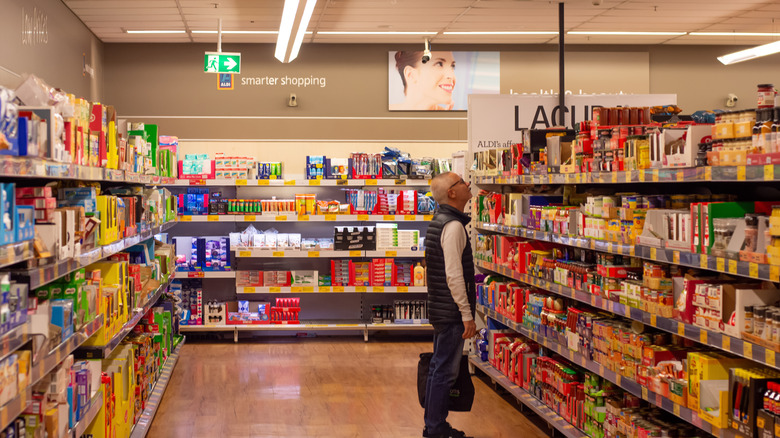 Man standing in grocery isle