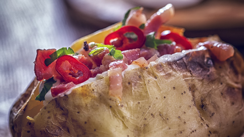 baked potato with herbs and chilies