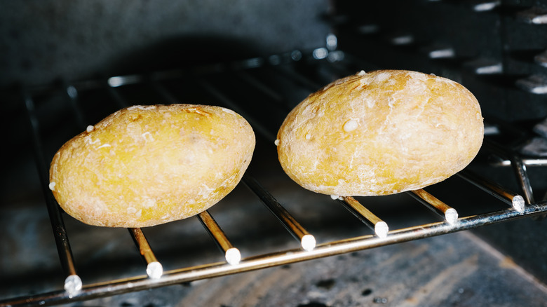 baked potatoes on rack in oven