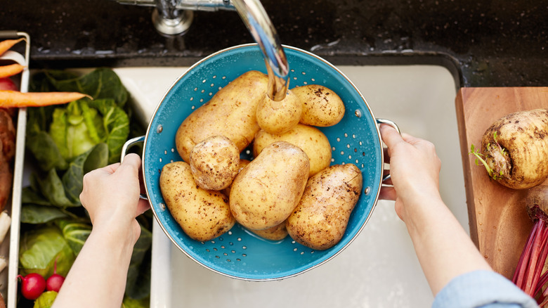 washing potatoes