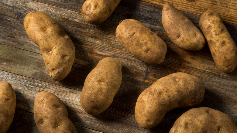 russet potatoes on wood