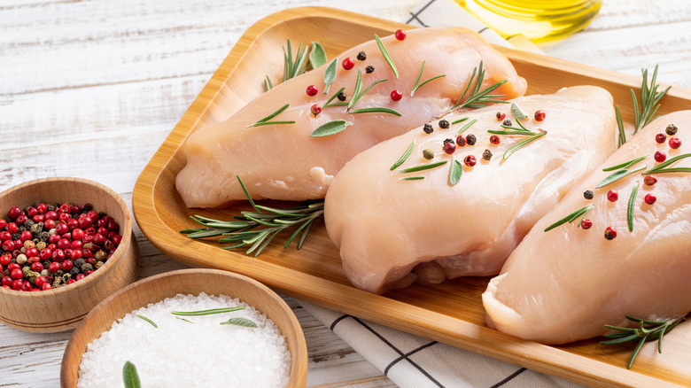 raw chicken breast with spices