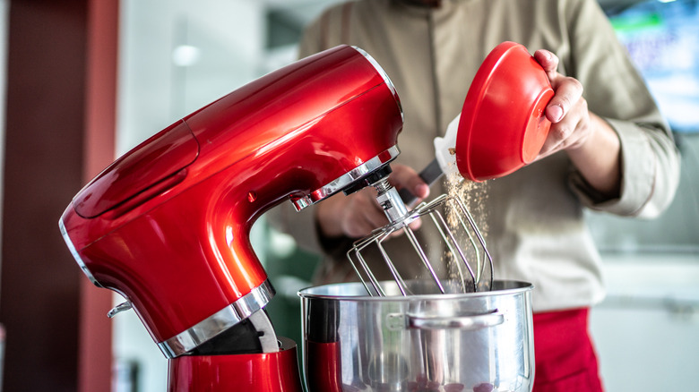 putting ingredients in mixer bowl