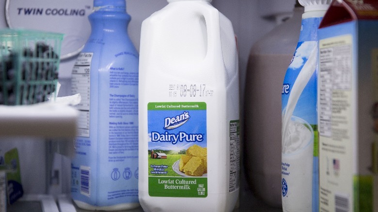 Container of buttermilk in fridge