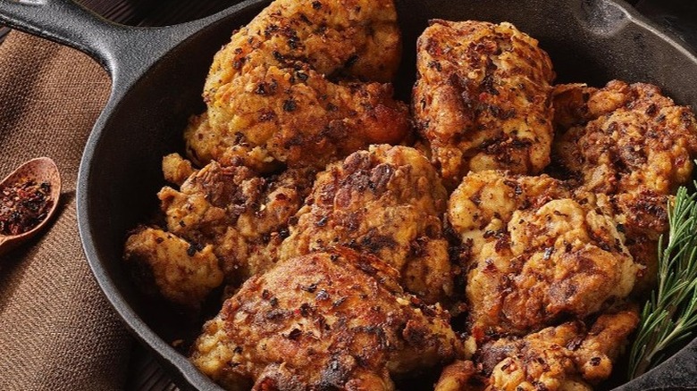 Chicken crowded in skillet