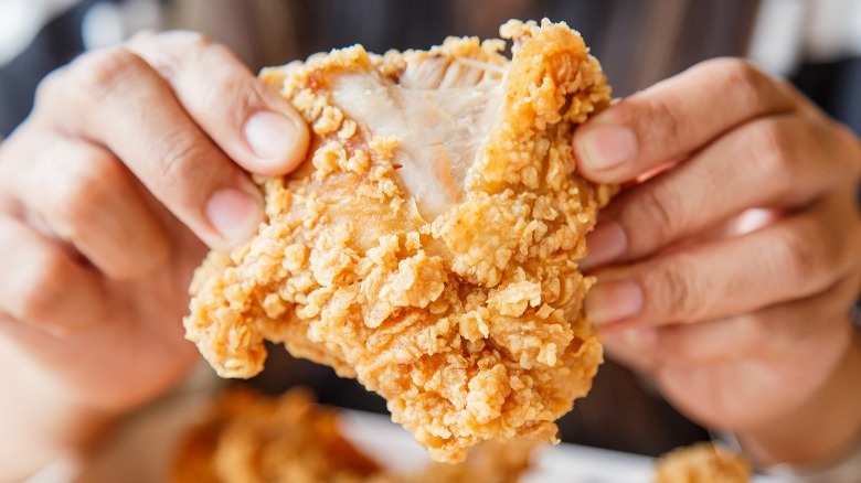 Splitting a piece of fried chicken