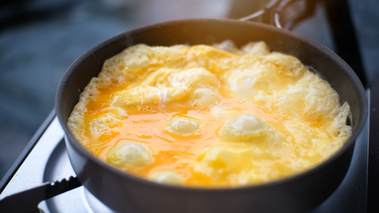 omelet cooking in pan