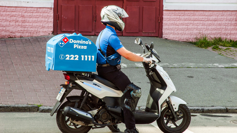 Domino's delivery driver on motorcycle