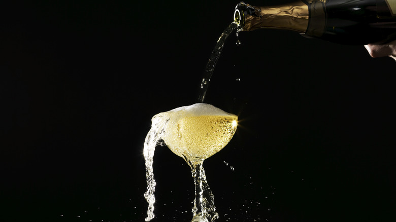 An overflowing champagne glass