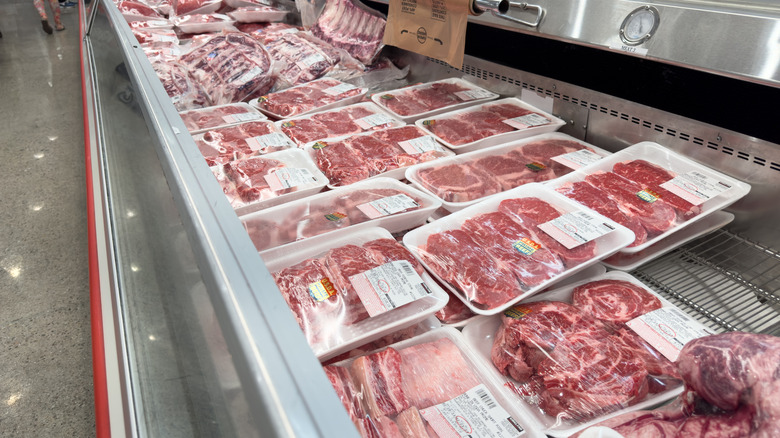 Meat display in Costco store, showing multiple packs of raw beef