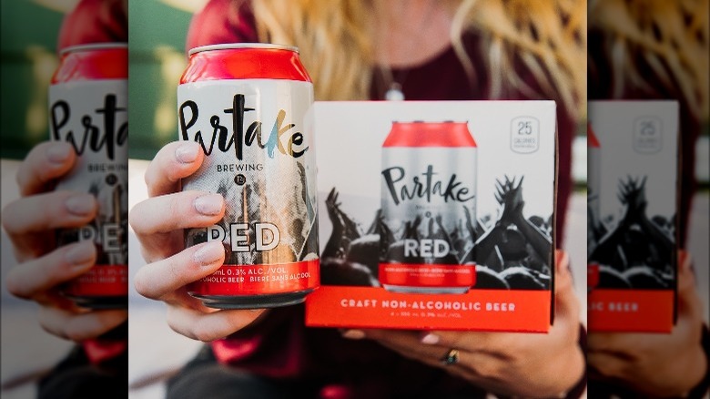 Person holding Partake Red beer
