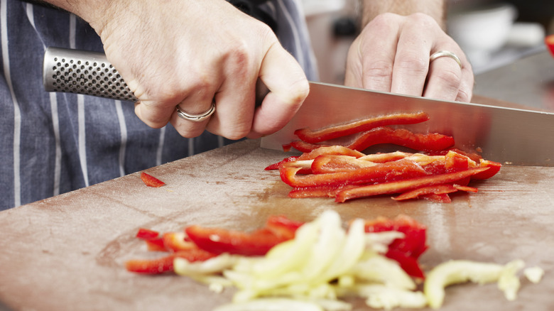 Chopping onions and peppers