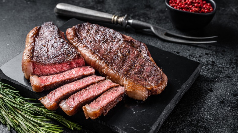 Sliced steak on a board