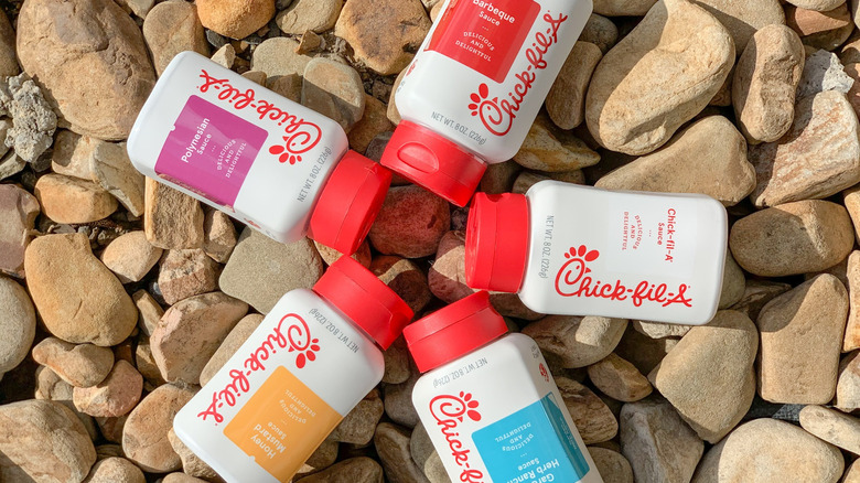 Chick-fil-A sauce bottles on rocks