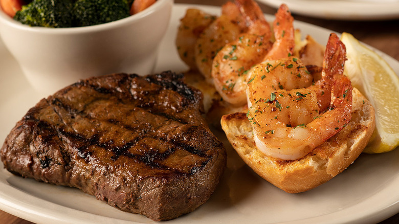 Steak and shrimp on plate