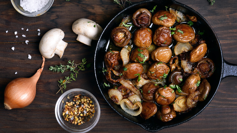 Frying a pan of mushrooms