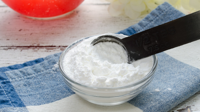 Measuring spoon in baking powder