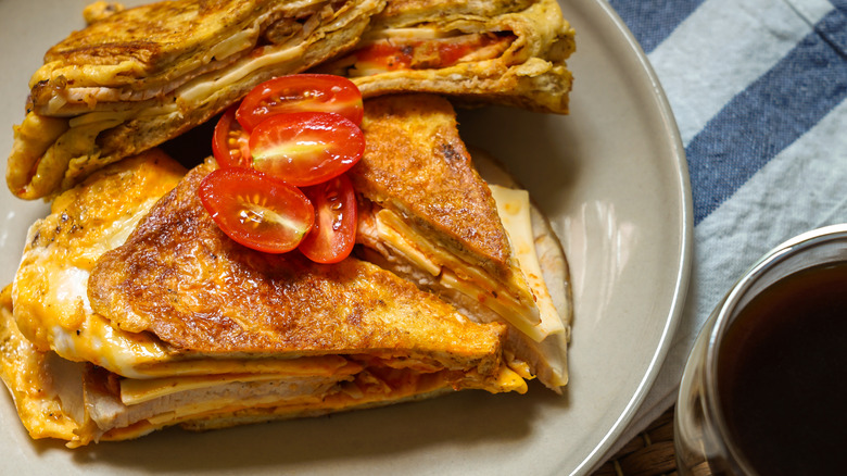 Omelet sandwich and glass