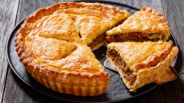 Baked meat pie with steam holes