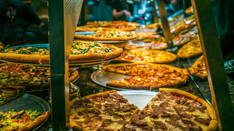 Pizzas on display in shop window