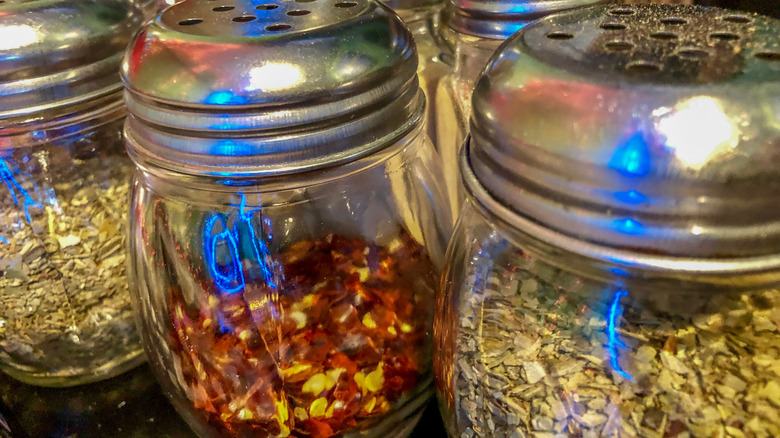 Oregano and red pepper flake shakers