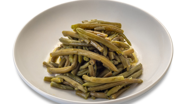 boiled green beans on white plate