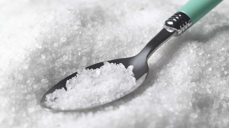 a teaspoon resting in rock salt