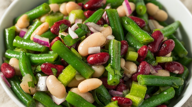 bowl of three bean salad with green beans, kidney beans, and cannellini beans