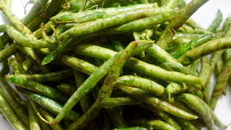 a pile of rotten green beans