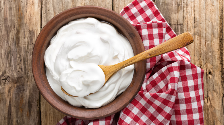 greek yogurt and wooden spoon