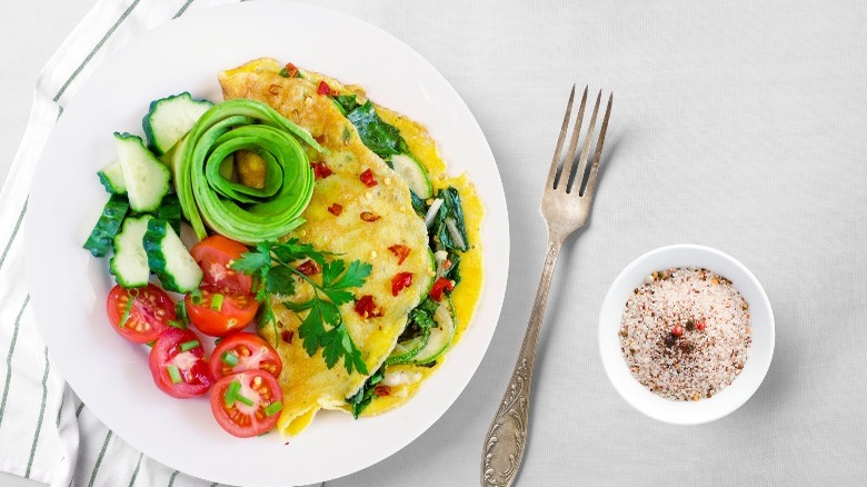 omelette with red pepper flakes, cherry tomatoes