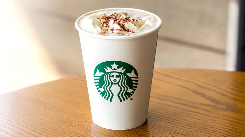 Starbucks cup with whipped cream