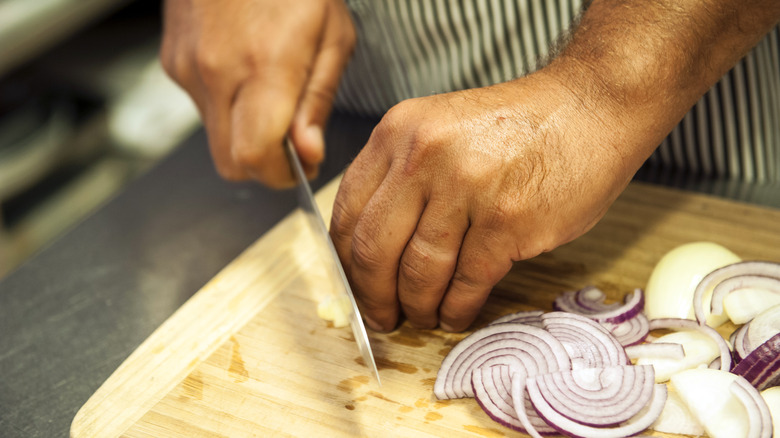 chopping garlic and red onion