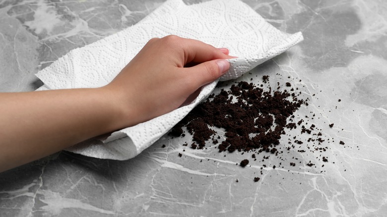 cleaning coffee grounds with paper towel