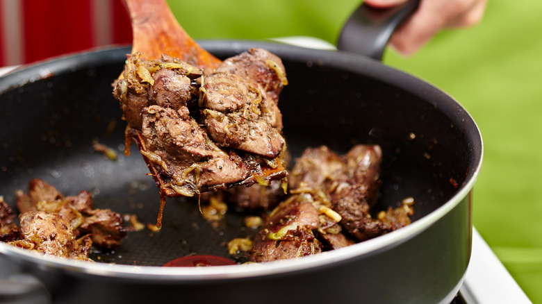 Giblets cooking in a pan