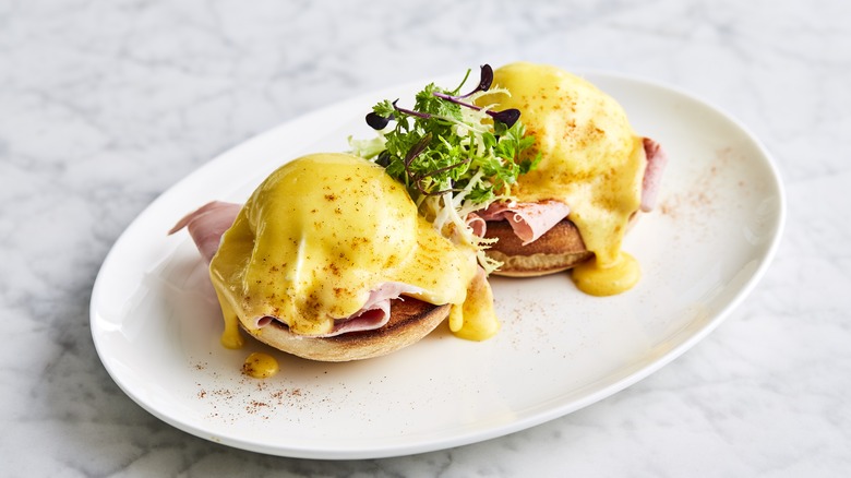 eggs Benedict on oval plate