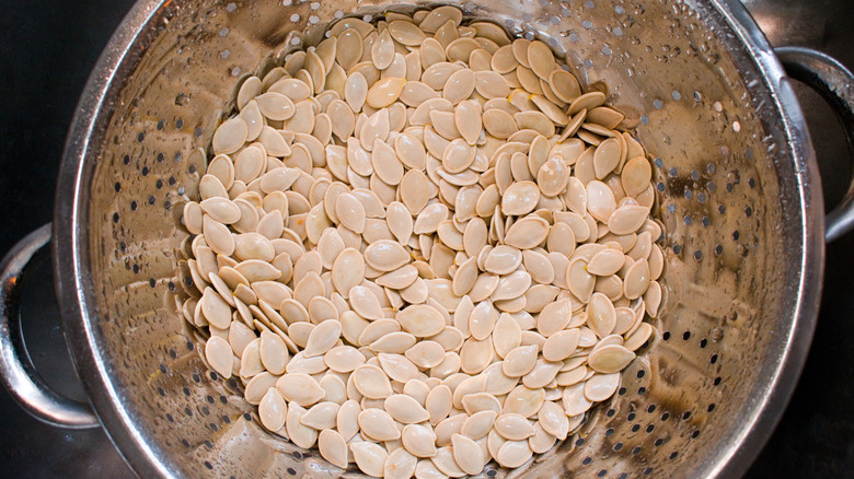 Pumpkin seeds in a strainer