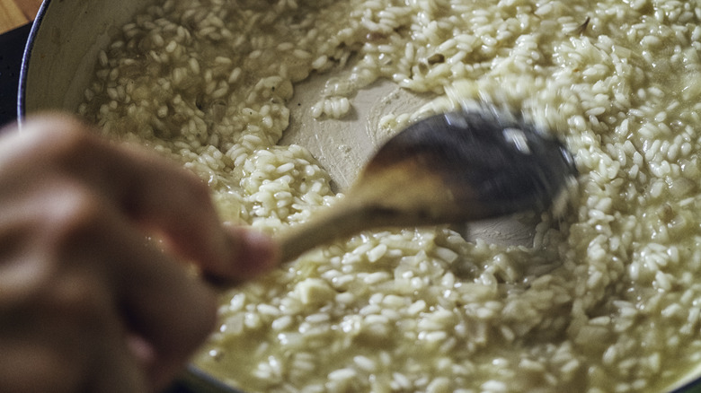 hand stirring risotto