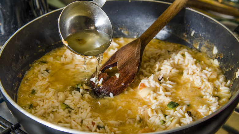 seafood risotto cooking in pot