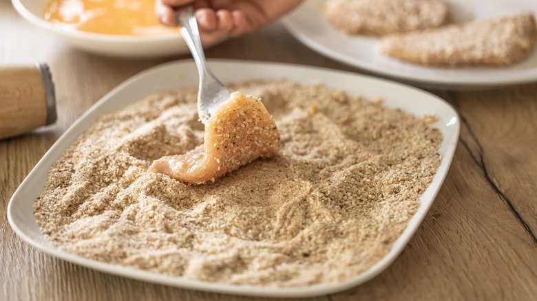 coating meat in breadcrumbs