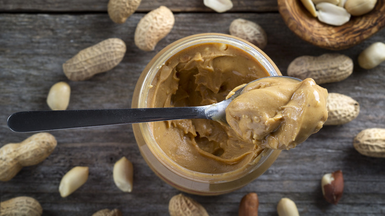 jar and spoon of peanut butter