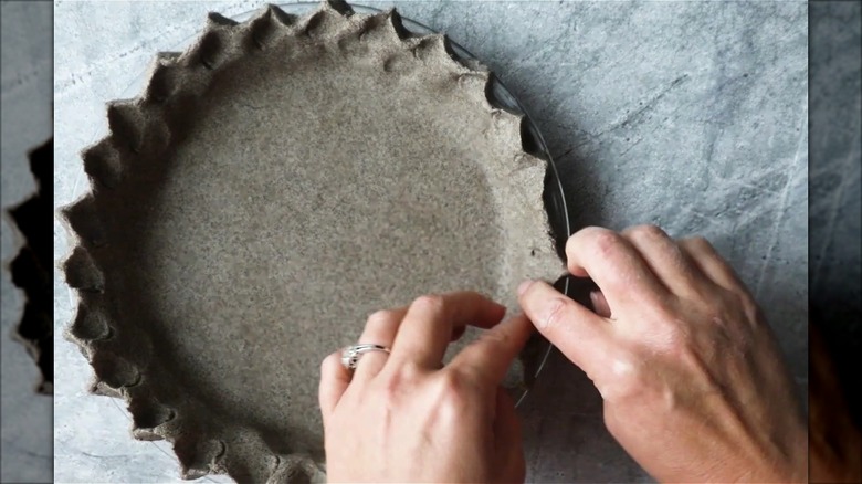 Buckwheat pie crust being crimped