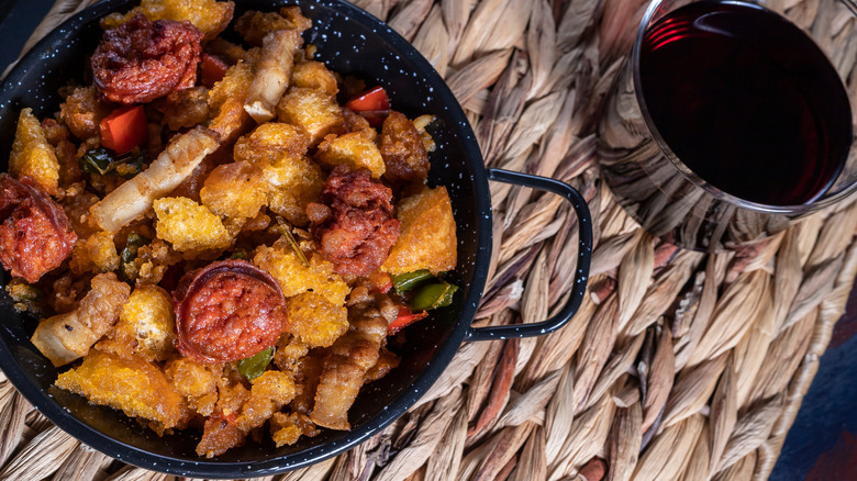 Spanish migas on straw table