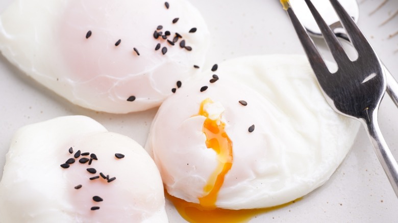 Poached eggs with black sesame seeds