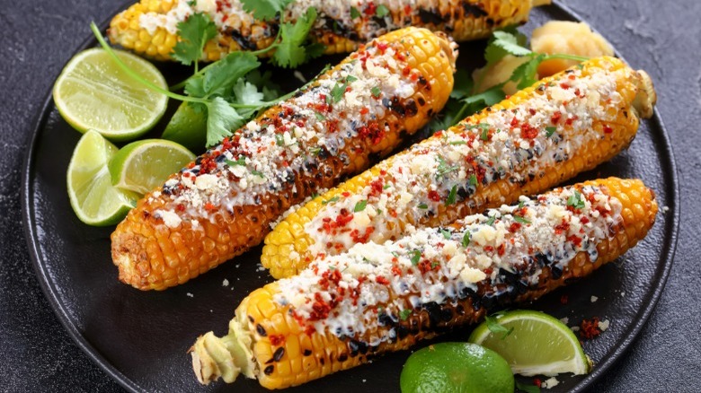 Three ears of Mexican street corn