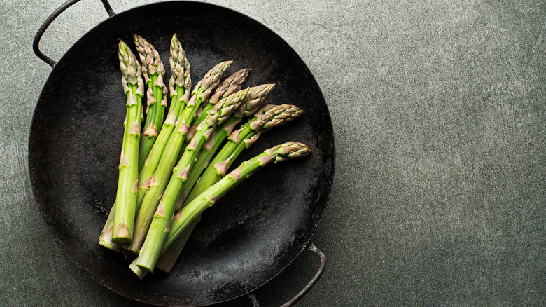 fresh asparagus in pan